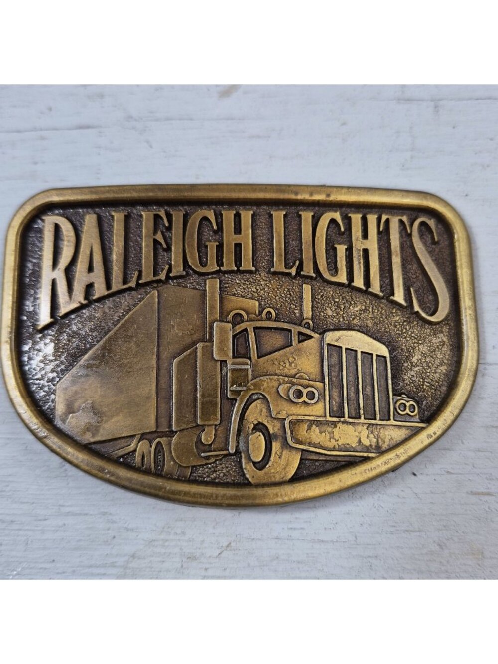 Vintage Raleigh Lights Semi Truck RJ Brass Tone Cigarette Belt Buckle